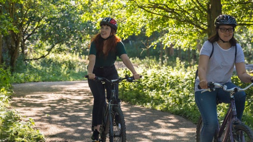 Two girls cycling at Nostell Priory and Parkland, West Yorkshire